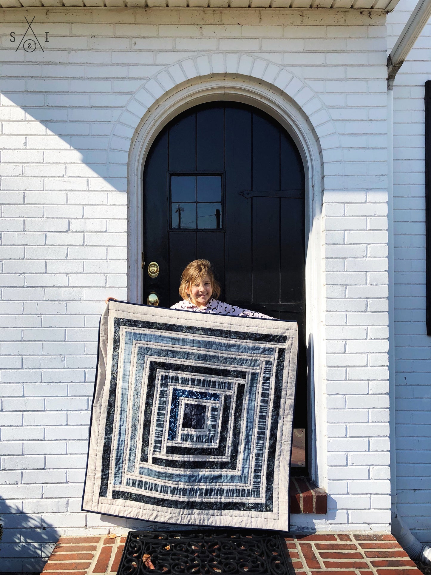 campfire baby quilt: blue batiks and osnaburg fabric