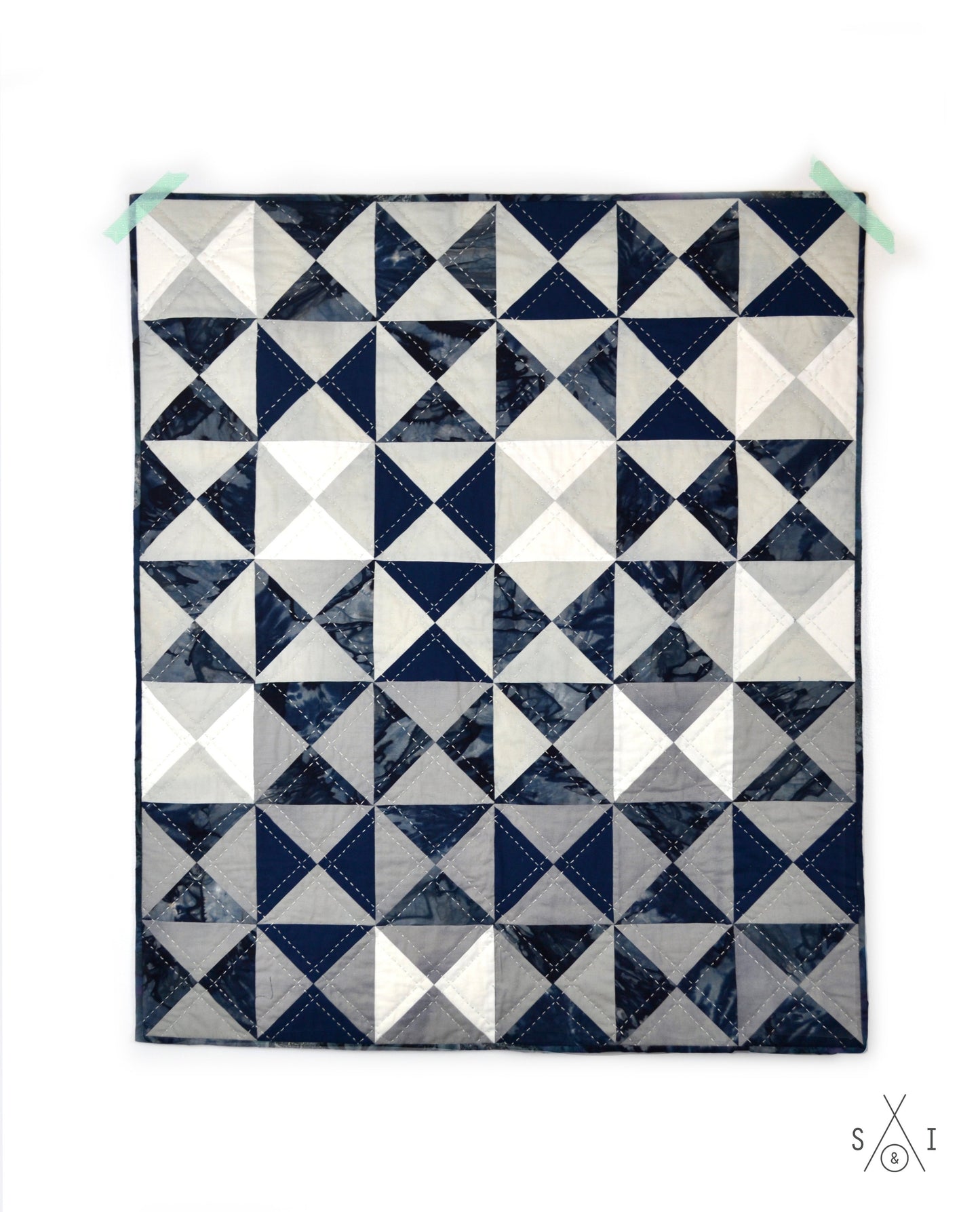 quarter square triangle baby quilt: ombre and blue batik