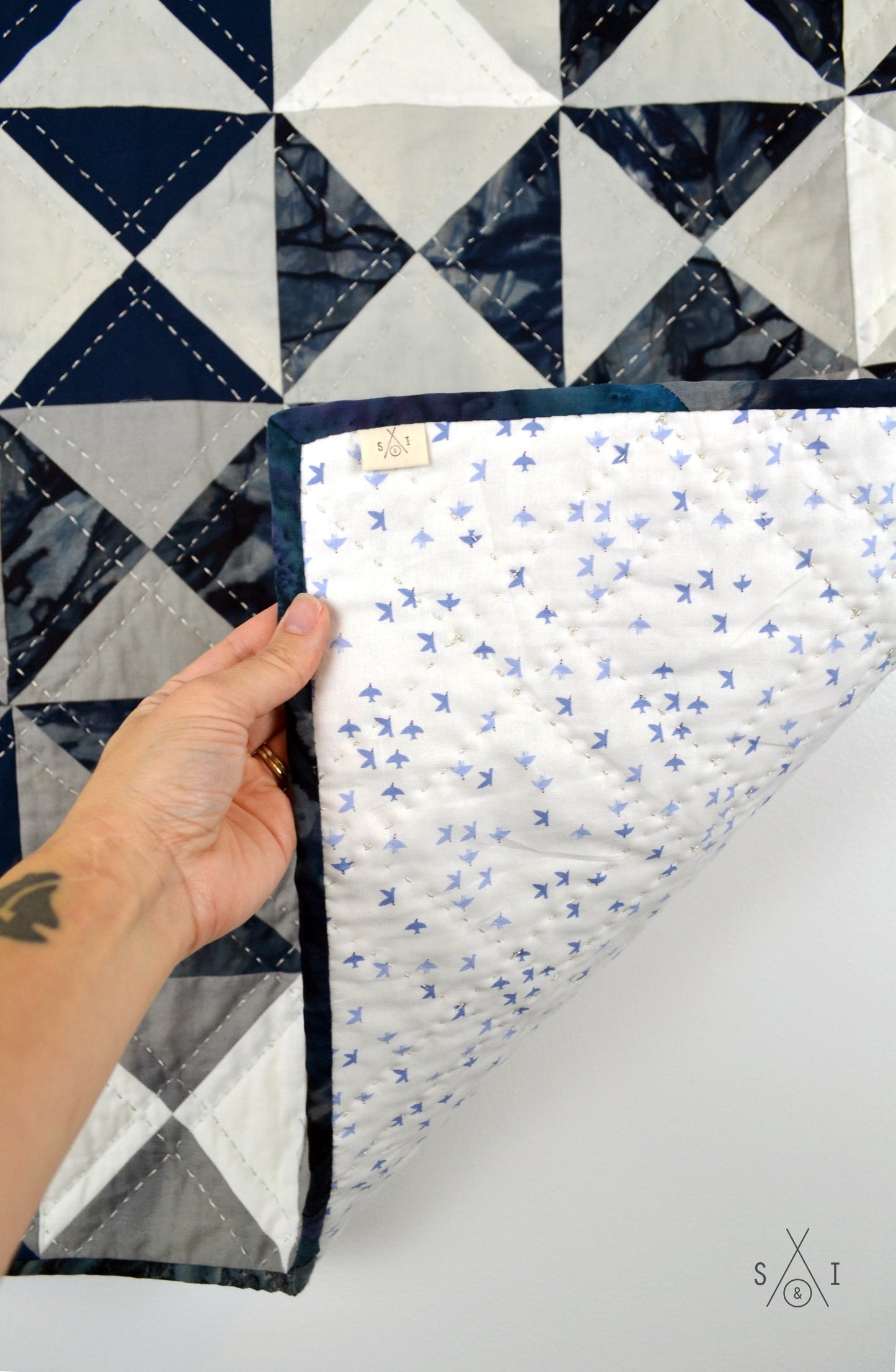quarter square triangle baby quilt: ombre and blue batik
