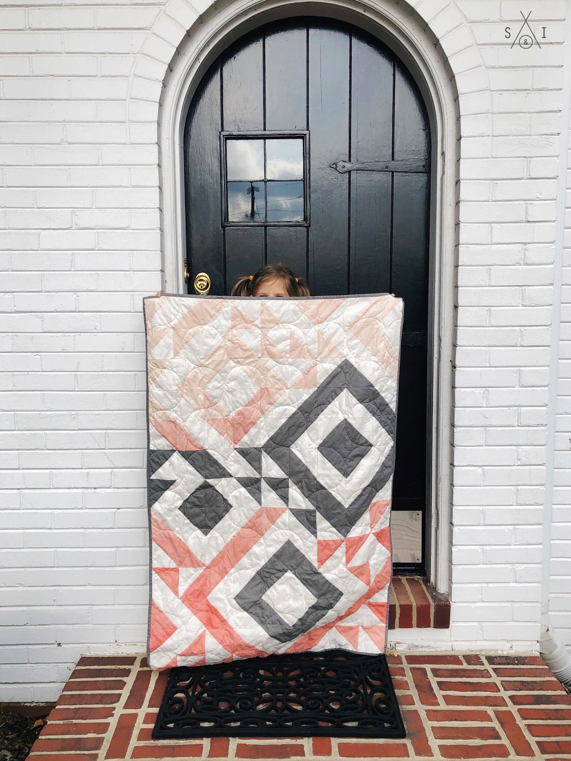 Triangle Jitters half square triangles baby quilt: ombre pink and gray