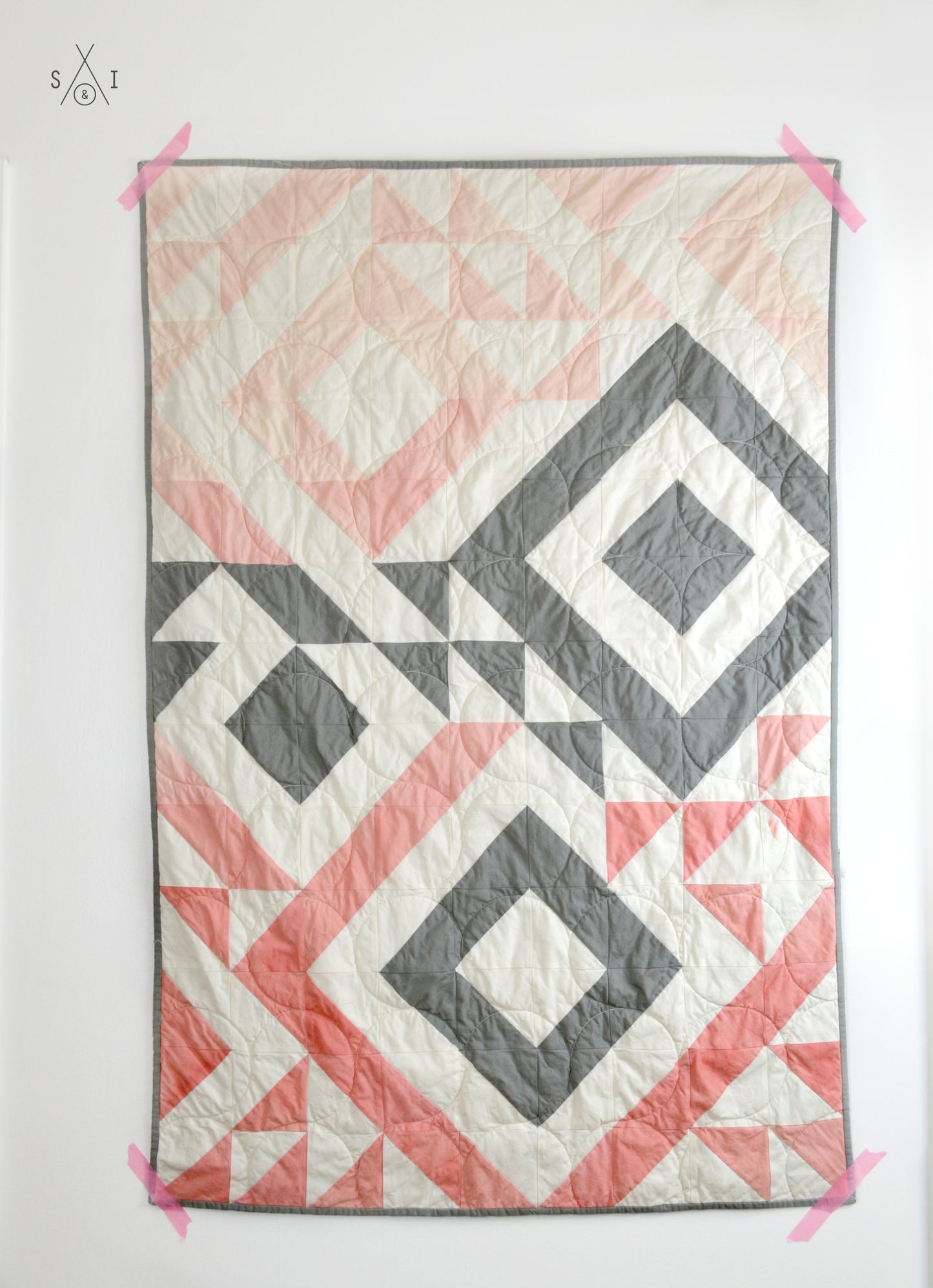 Triangle Jitters half square triangles baby quilt: ombre pink and gray